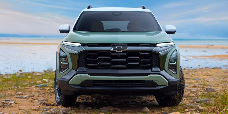 Green 2026 Chevrolet Equinox parked near a lake in Cut Off, LA