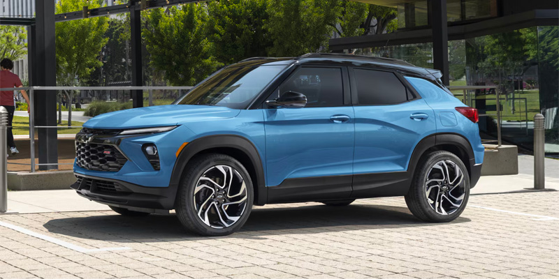 2026 Chevrolet Trailblazer parked outside a building, side profile view, blue color